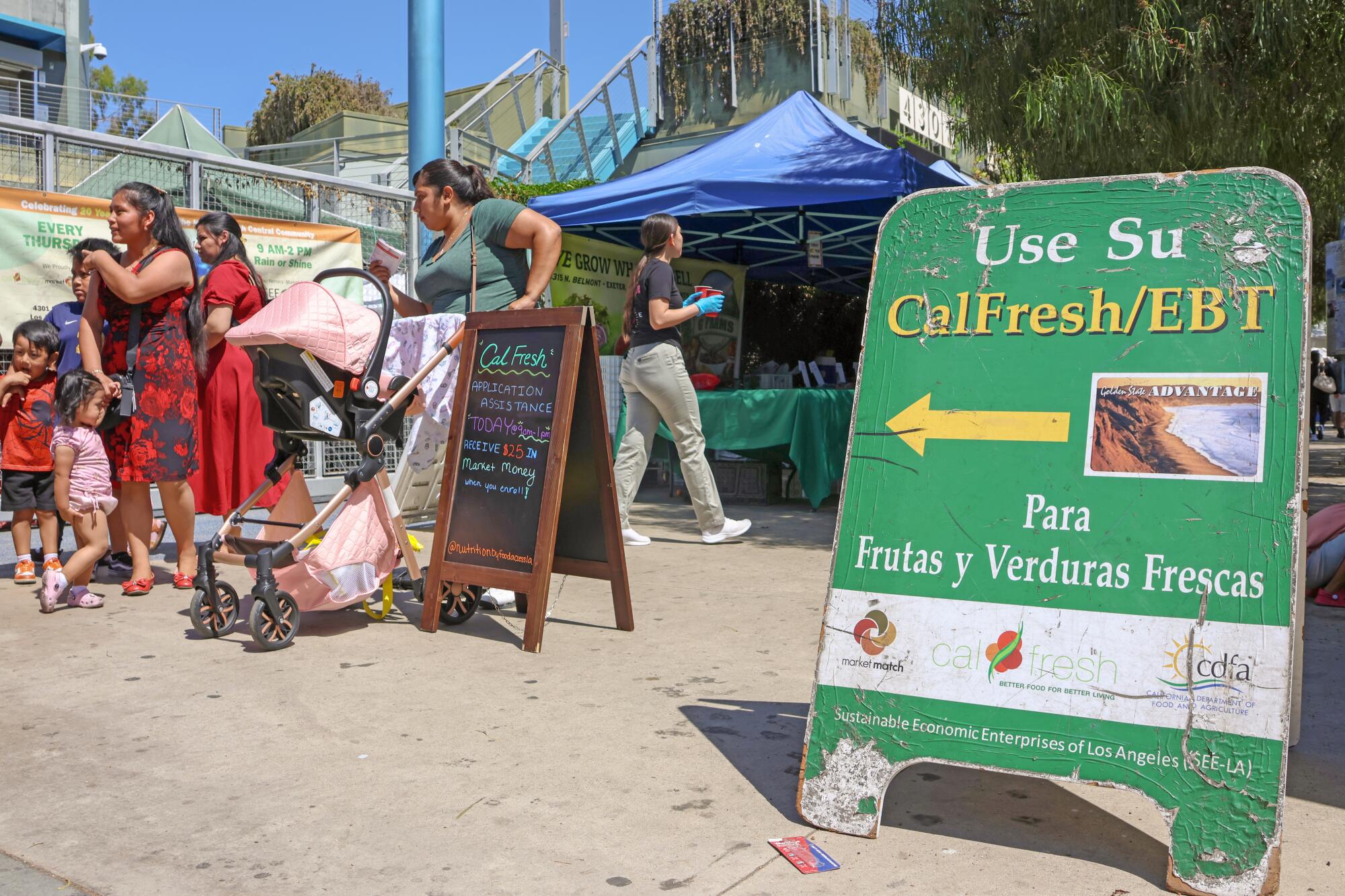 Families and shoppers at the Central Avenue Farmers Market in a Los Angeles Times feature by Nava Rawls